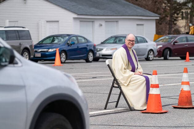 April 1, 2020, Chelmsford, Massachusetts, USA: Father Brian Mahoney at drive-up confessions in the parking lot of St. Mary Catholic Church during Covid-19 pandemic in Chelmsford.  (124964590)