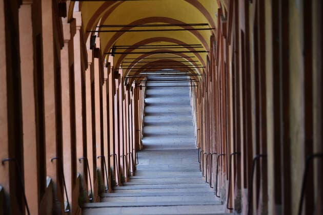 (200401) -- BOLOGNA, April 1, 2020 (Xinhua) -- The Portico di San Luca is seen empty in Bologna, Italy, on April 1, 2020. Italy registered a total of 110,574 COVID-19 cases as of Wednesday, and the death toll stood at 13,155, according to fresh figures released by the country s Civil Protection Department managing the national emergency response. (Photo by Gianni Schicchi Xinhua) ITALY-BOLOGNA-COVID-19-CASES 