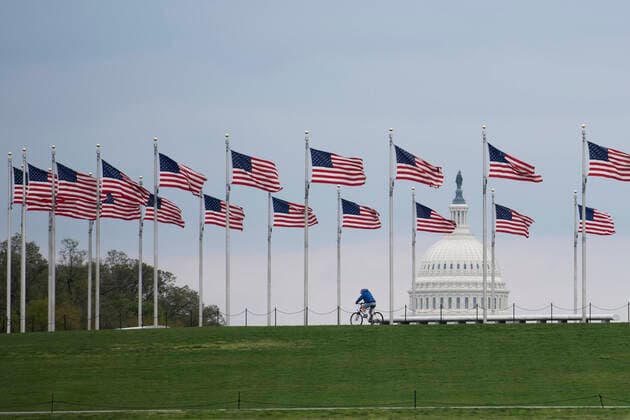 (200402) -- WASHINGTON D.C., April 2, 2020 -- A man rides a bicycle during the outbreak of COVID-19 in Washington D.C., the United States, April 1, 2020. The United States became the first nation with more than 200,000 COVID-19 infections on Wednesday, according to a new tally from Johns Hopkins University. ) U.S.-WASHINGTON D.C.-COVID-19 LiuxJie 