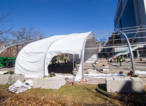 (200402) -- BURLINGTON, April 2, 2020 -- Workers construct a new modular structure on the grounds of Joseph Brant Hospital in Burlington, Toronto, Canada, April 1, 2020. Called as the Pandemic Response Unit (PRU), Ontario province s first temporary facility for COVID-19 patients is being built in Burlington and will provide an additional 93 beds. The number of COVID-19 cases has continued to rise in Canada. As of Wednesday afternoon, there were 9,560 confirmed cases, with 101 deaths, across the country. (Photo by Xinhua) CANADA-TORONTO-COVID-19-TEMPORARY FACILITY-CONSTRUCTION ZouxZheng