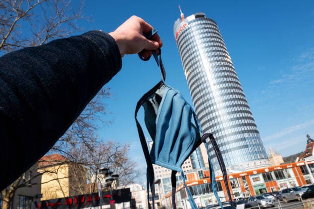 Two hand-sewn masks for the coming mouth noses protection compulsory mask duty in Jena In the background the JenTower and Eichplatz Photo of 2 4 2020 downtown Jena