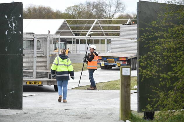 . 02 04 2020. London, United Kingdom. Coronavirus crisis. Builders seen carrying works for the new mortuary on the site owned by the City of London Corporation. A new mortuary for coronavirus victims, is been building on forest land next to the City of London Cemetery and Crematorium and is expected to take the dead from the new Nightingale Hospital at the ExCel Centre.  xGustavoxValientex xi-Imagesx IIM-20974-0001