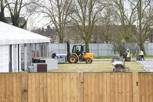 . 02 04 2020. London, United Kingdom. Coronavirus crisis. Builders seen carrying works for the new mortuary on the site owned by the City of London Corporation. A new mortuary for coronavirus victims, is been building on forest land next to the City of London Cemetery and Crematorium and is expected to take the dead from the new Nightingale Hospital at the ExCel Centre.  xGustavoxValientex xi-Imagesx IIM-20974-0004