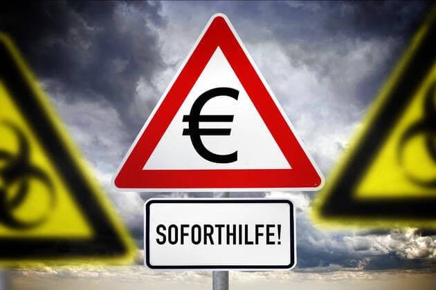 PHOTOMONTAGE, sign with Euro sign and lettering Emergency aid, symbol photo Corona help ** NUR FUER REDAKTIONELLE ZWECKE ** EDITORIAL USE ONLY **