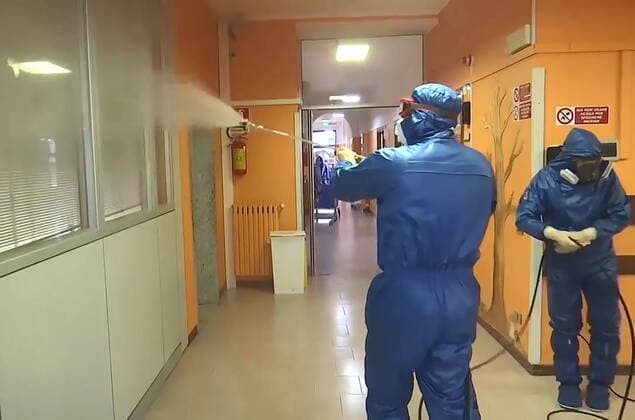 LOMBARDY, ITALY - APRIL 2, 2020: A brigade of Russian epidemiologists and experts of the Troops of Radiological, Chemical and Biological Defence of the Russian Defence Ministry carry out a full disinfection of the Milesi retirement home in the commune of Gromo, the province of Bergamo. Video screen grab. Russian Defence Ministry TASS  TS0D42E7