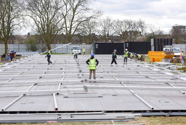 . 02 04 2020. London, United Kingdom. Coronavirus crisis. Builders seen carrying out works for the new mortuary on Manor Park. A new mortuary for coronavirus victims, is been building on forest land next to the City of London Cemetery and Crematorium and is expected to take the dead from the new Nightingale Hospital at the ExCel Centre.  xGustavoxValientex xi-Imagesx IIM-20974-0016