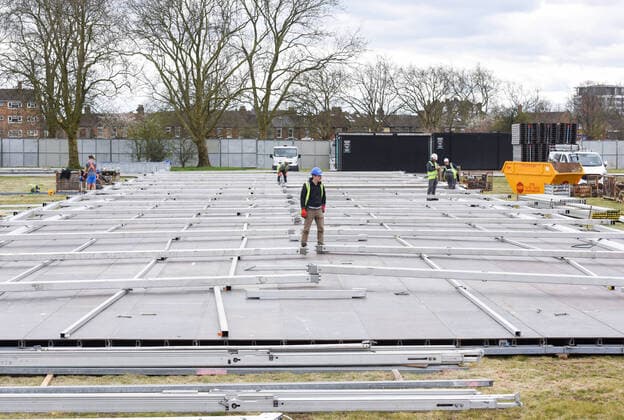 . 02 04 2020. London, United Kingdom. Coronavirus crisis. Builders seen carrying out works for the new mortuary on Manor Park. A new mortuary for coronavirus victims, is been building on forest land next to the City of London Cemetery and Crematorium and is expected to take the dead from the new Nightingale Hospital at the ExCel Centre.  xGustavoxValientex xi-Imagesx IIM-20974-0023