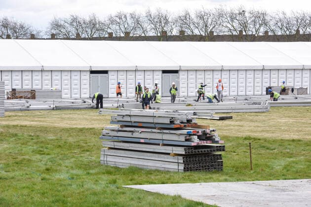 . 02 04 2020. London, United Kingdom. Coronavirus crisis. Builders seen carrying out works for the new mortuary on Manor Park. A new mortuary for coronavirus victims, is been building on forest land next to the City of London Cemetery and Crematorium and is expected to take the dead from the new Nightingale Hospital at the ExCel Centre.  xGustavoxValientex xi-Imagesx IIM-20974-0024