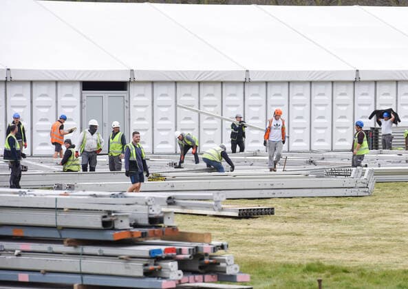 . 02 04 2020. London, United Kingdom. Coronavirus crisis. Builders seen carrying out works for the new mortuary on Manor Park. A new mortuary for coronavirus victims, is been building on forest land next to the City of London Cemetery and Crematorium and is expected to take the dead from the new Nightingale Hospital at the ExCel Centre.  xGustavoxValientex xi-Imagesx IIM-20974-0025