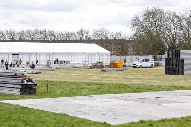 . 02 04 2020. London, United Kingdom. Coronavirus crisis. Builders seen carrying out works for the new mortuary on Manor Park. A new mortuary for coronavirus victims, is been building on forest land next to the City of London Cemetery and Crematorium and is expected to take the dead from the new Nightingale Hospital at the ExCel Centre.  xGustavoxValientex xi-Imagesx IIM-20974-0026