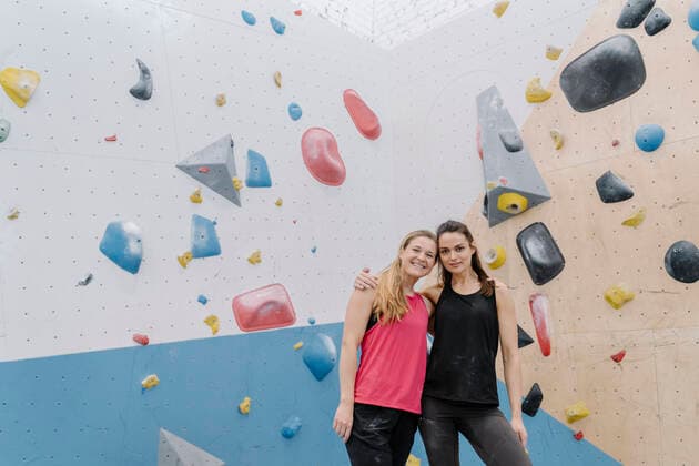 Portrait of two smiling women in climbing gym model released Symbolfoto property released  AHSF01966