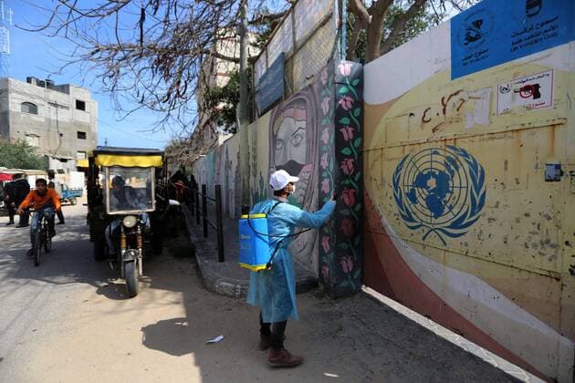 April 2, 2020, Dair Al Balah, Gaza Strip, Palestinian Territory: Palestinian workers spray disinfectant as a preventive measure amid fears of the spread of the coronavirus disease (COVID-19), in Dair Al Balah in the center of Gaza strip, on April 2, 2020 Dair Al Balah Palestinian Territory - ZUMAap3_ 20200402_zaf_ap3_065 Copyright: xAshrafxAmrax