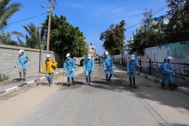 April 2, 2020, Dair Al Balah, Gaza Strip, Palestinian Territory: Palestinian workers spray disinfectant as a preventive measure amid fears of the spread of the coronavirus disease (COVID-19), in Dair Al Balah in the center of Gaza strip, on April 2, 2020 Dair Al Balah Palestinian Territory - ZUMAap3_ 20200402_zaf_ap3_066 Copyright: xAshrafxAmrax