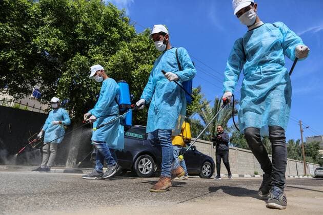 April 2, 2020, Dair Al Balah, Gaza Strip, Palestinian Territory: Palestinian workers spray disinfectant as a preventive measure amid fears of the spread of the coronavirus disease (COVID-19), in Dair Al Balah in the center of Gaza strip, on April 2, 2020 Dair Al Balah Palestinian Territory - ZUMAap3_ 20200402_zaf_ap3_067 Copyright: xAshrafxAmrax