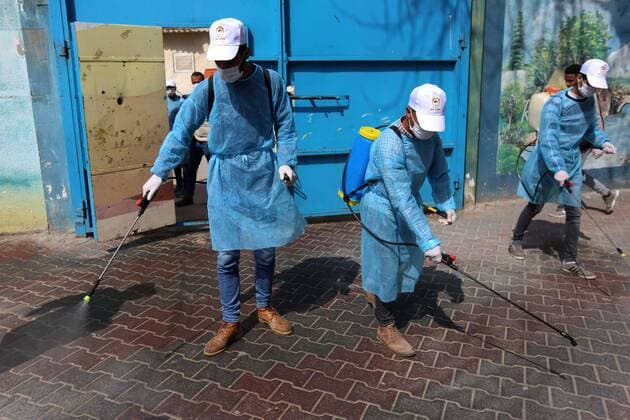 April 2, 2020, Dair Al Balah, Gaza Strip, Palestinian Territory: Palestinian workers spray disinfectant inside an UNRWA school as a preventive measure amid fears of the spread of the coronavirus disease (COVID-19), in Dair Al Balah in the center of Gaza strip, on April 2, 2020 Dair Al Balah Palestinian Territory - ZUMAap3_ 20200402_zaf_ap3_069 Copyright: xAshrafxAmrax