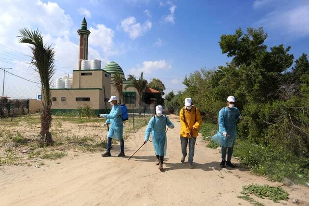 April 2, 2020, Dair Al Balah, Gaza Strip, Palestinian Territory: Palestinian workers spray disinfectant as a preventive measure amid fears of the spread of the coronavirus disease (COVID-19), in Dair Al Balah in the center of Gaza strip, on April 2, 2020 Dair Al Balah Palestinian Territory - ZUMAap3_ 20200402_zaf_ap3_077 Copyright: xAshrafxAmrax