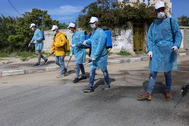 April 2, 2020, Dair Al Balah, Gaza Strip, Palestinian Territory: Palestinian workers spray disinfectant as a preventive measure amid fears of the spread of the coronavirus disease (COVID-19), in Dair Al Balah in the center of Gaza strip, on April 2, 2020 Dair Al Balah Palestinian Territory - ZUMAap3_ 20200402_zaf_ap3_082 Copyright: xAshrafxAmrax