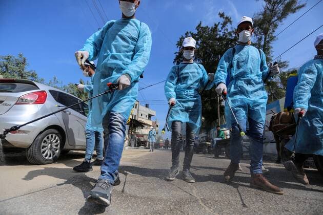 April 2, 2020, Dair Al Balah, Gaza Strip, Palestinian Territory: Palestinian workers spray disinfectant as a preventive measure amid fears of the spread of the coronavirus disease (COVID-19), in Dair Al Balah in the center of Gaza strip, on April 2, 2020 Dair Al Balah Palestinian Territory - ZUMAap3_ 20200402_zaf_ap3_090 Copyright: xAshrafxAmrax