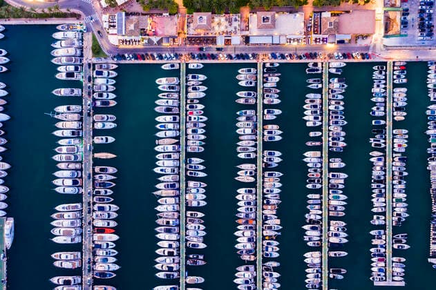 Spain, Balearic Islands, Mallorca, Portals Nous, Puerto Portals, Aerial view of luxury marina at sunset  AMF07881