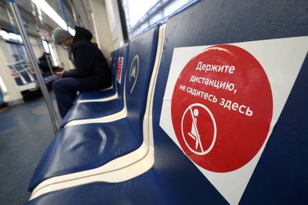MOSCOW, RUSSIA - APRIL 2, 2020: A man on a Moscow Metro train. The Moscow authorities imposed home isolation for all Moscow residents, regardless of their age, and restrictions on movement within the city, effective since March 30, 2020, as a measure to contain the spread of the COVID-19 coronavirus infection. Violations of the stay-at-home order carry fines ranging from 1,000 to 40,000 rubles for non-infected people, and up to 1m rubles or imprisonment for up to 3 years for infected people, depending on the severity of consequences. Stanislav Krasilnikov TASS TS0D438F