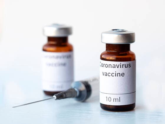 April 2, 2020, Ukraine: In this photo illustration two vials labelled Coronavirus vaccine and syringe are seen on display..The world is anxiously awaiting for a vaccine against coronavirus. Ukraine - ZUMAs197 20200402_zab_s197_006 Copyright: xIgorxGolovniovx