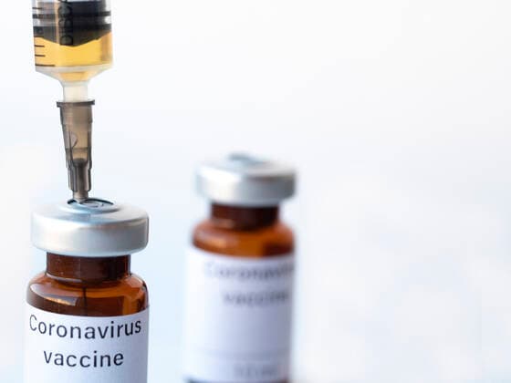 April 2, 2020, Ukraine: In this photo illustration two vials labelled Coronavirus vaccine and syringe are seen on display..The world is anxiously awaiting for a vaccine against coronavirus. Ukraine - ZUMAs197 20200402_zab_s197_009 Copyright: xIgorxGolovniovx