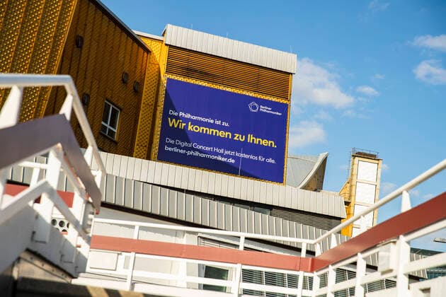 A banner on the Philharmonie with advertising about a free month Digital Concert Hall due to the coronavirus in Berlin on April 2, 2020 To slow down the spread of the coronavirus SARS CoV 2, federal and state