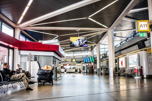 Airport Tegel, TXL These travellers come from Kolunmbien and wait in front of a gate for their onward journey to Poland Berlin Tegel Otto Lilienthal Airport is only operated to a very limited extent due to the corona crisis, there is a total emptiness