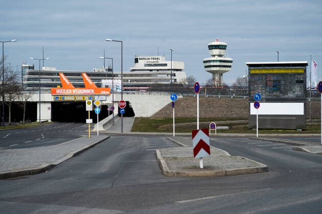 Airport Tegel, TXL The forecourt in the approach to Tegel Airport with advertising poster and billboard in total emptiness Berlin Tegel Otto Lilienthal Airport is only operated to a very limited extent due to the corona crisis, there is a total empti