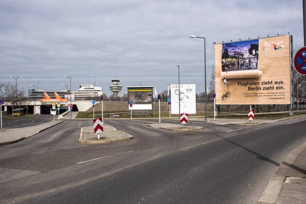Airport Tegel, TXL The forecourt in the approach to Tegel Airport with advertising poster and billboard in total emptiness Berlin Tegel Otto Lilienthal Airport is only operated to a very limited extent due to the corona crisis, there is a total empti