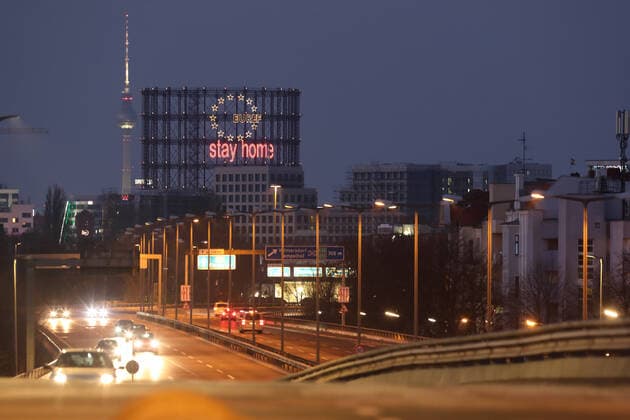 02 04 2020, Berlin, GER View of the Schoeneberg gasometer with the lettering stay home and the Berlin TV tower at dusk Evening, evening, everyday life, outside, outdoor, outdoor