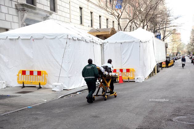 April 2, 2020, New York City, New York, US: Hectic scene at an overwhelmed Lennox Hill Hospital on Manhattan s East-side on 2 April, 2020, with some coronavirus (COVID-19) patients being transported to the hospital and others being moved. Pictured is a refrigerated truck, to be used as a temporary morgue, on stand-by at the hospital. New York City US - ZUMAl135 20200402_zap_l135_017 Copyright: xG.xRonaldxLopezx