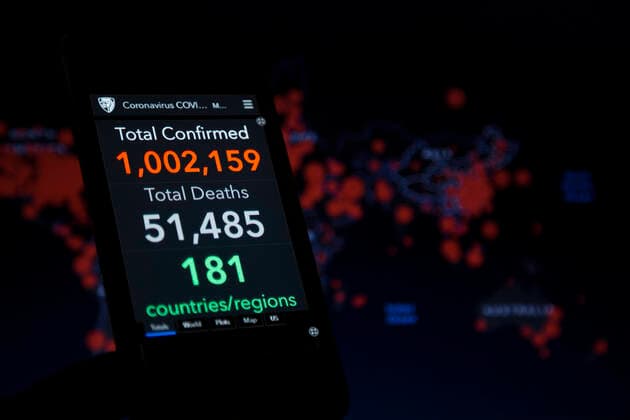 April 2, 2020, Asuncion, Paraguay: Illustration photo - Coronavirus COVID-19 Global Cases by the Center for Systems Science and Engineering (CSSE) at Johns Hopkins University (JHU), data shows global total confirmed cases passes 1 million mark, seen on a smartphone screen backdropped by the JHU CSSE website world map. Asuncion Paraguay - ZUMAc217 20200402_zip_c217_005 Copyright: xAndrexM.xChangx