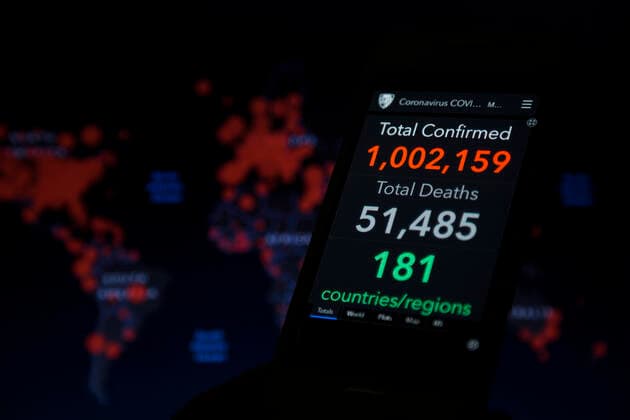 April 2, 2020, Asuncion, Paraguay: Illustration photo - Coronavirus COVID-19 Global Cases by the Center for Systems Science and Engineering (CSSE) at Johns Hopkins University (JHU), data shows global total confirmed cases passes 1 million mark, seen on a smartphone screen backdropped by the JHU CSSE website world map. Asuncion Paraguay - ZUMAc217 20200402_zip_c217_007 Copyright: xAndrexM.xChangx