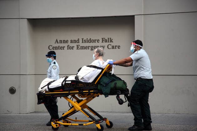 April 2, 2020, New York City, New York, US: A patient is being transported into the hospital during a hectic scene at an overwhelmed Lennox Hill Hospital on Manhattan s East-side with some coronavirus (COVID-19) patients being transported to the hospital and others being moved. New York City USA - ZUMAl135 20200402_zap_l135_039 Copyright: xG.xRonaldxLopezx