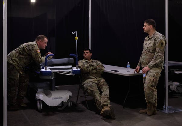 April 2, 2020, Worcester, Massachusetts, US: The Massachusetts National Guard in cooperation with FEMA and Umass Memorial Medical Cenetr are building a COVID-19, Corona Virus, field hospital to treat midlly ill paitents at the DCU Center in Worcester, Massachusetts. The facility will have 250 beds for those who are too sick to be home, but not in need of an Intensive Care Unit. Worcester US - ZUMAd211 20200402_zap_d211_013 Copyright: xAllisonxDinnerx
