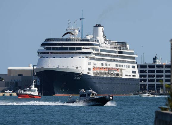 ORT LAUDERDALE FL - APRIL 02: The Zaandam cruise ship is docked at Port Everglades. The Holland America cruise ship had been at sea for the past 19 days after South American ports denied their entry due to the coronavirus outbreak after people tested positive for COVID-19. on April 2, 2020 in Fort Lauderdale, Florida Copyright: xmpi04x