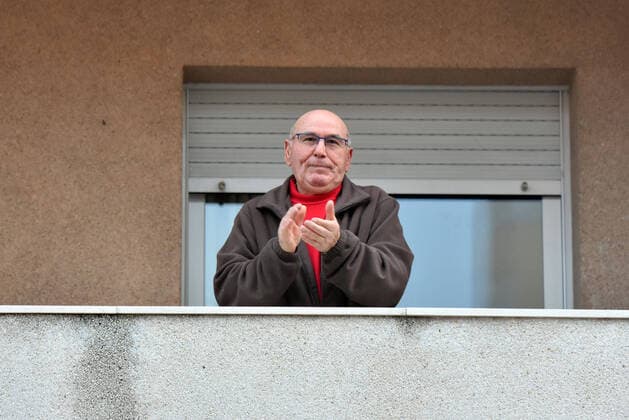 April 2, 2020, El Vendrell, Spain: A man applauds from the terrace of his house to show gratitude to the Covid-19 fighters..In Spain, every night at 08:00 pm and all the cities of the country, citizens who are confined at home during the state of alarm decreed by the Government of Spain since March 16, go out to their terraces and applaud to show gratitude to all the people such as health workers, police, fire fighters, supermarket staff, truckers, and cleaning staff for their great work in fighting the Covid-19 crisis. El Vendrell Spain - ZUMAs197 20200402_zaa_s197_073 Copyright: xRamonxCostax