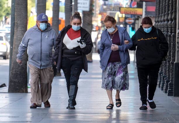 April 2, 2020, Los Angeles, California, U.S: People wearing face masks walk along the Hollywood Walk of Fame on April 2, 2020 in Los Angeles. Los Angeles Mayor Eric Garcetti is advising the public to wear any kind of protective face covering when going out -- even a scarf or other clothing item -- to reduce the spread of the coronavirus. Los Angeles U.S. - ZUMAc68_ 20200402_zaf_c68_010 Copyright: xRingoxChiux