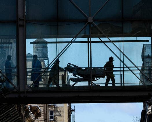 April 2, 2020, New York, New York, USA: Nurses push the dead body of a patient who died of Coronavirus at Mount Sinai Morningside. The New York City death toll tops 1,500 as officials warned that the worst of the toll is yet to come. New York Manhattan USA - ZUMAs252 20200402_znp_s252_008 Copyright: xMarcusxSantosx