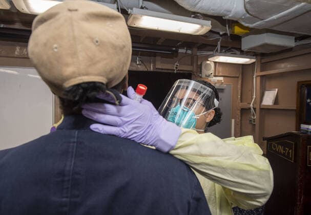March 31, 2020, Apra Harbor, Guam: APRA HARBOR, Guam (April 1, 2020) Hospital Corpsman 2nd Class Jason Castircone, from Dallas, wraps a swab sample in parafilm for COVID-19 testing aboard the aircraft carrier USS Theodore Roosevelt (CVN 71), April 1, 2020. Theodore Roosevelt is in Guam for a scheduled port visit for resupply and crew rest during their scheduled deployment to the Indo-Pacificring their scheduled deployment to the Indo-Pacific...People: USS Theodore Roosevelt. Apra Harbor Guam - ZUMAs214 20200331_zaa_s214_001 Copyright: xSMGx