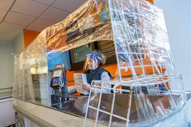 (200403) -- PARIS, April 3, 2020 (Xinhua) -- Photo taken on April 2, 2020 shows a cashier with protective measures at a frozen food store in Paris, France. French hospitals registered a one-day loss of 471 coronavirus patients, taking the total to 4,503, while some 900 dependant elder people living at nursing homes had died of the virus since the epidemic began, a health official said on Thursday. In total, 59,105 people had tested positive for the virus, up by 2,116 in one day, versus an increase of 4,861 on Wednesday, said Director General of Health Jerome Salomon at the daily conference on the epidemic. (Photo by Aurelien Morissard Xinhua) FRANCE-PARIS-COVID-19 