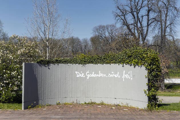 DEU, Germany, Baden Württemberg, Stuttgart, 03 04 2020 Stadtbahn stop Mineralbäder in Stuttgart A sprayer writes on a concrete wall The thoughts are free The thoughts are free is a German folk song about freedom of thought