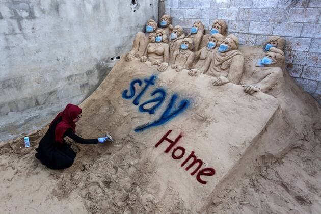 April 3, 2020, Gaza City, Gaza Strip, Palestinian Territory: A Palestinian artist Rana el-Ramlawi, 23, creates a sand sculpture stay home during awareness campaign about the spread of coronavirus disease (COVID-19), at her house Gaza city, on April 3, 2020. The United Nations has warned that a COVID-19 outbreak in Gaza could be disastrous, given the high poverty rates and weak health system in the coastal strip under Israeli blockade since 2007. Authorities in Gaza have said that more than 2,700 Palestinians are in home-isolation, mostly people who had returned from Egypt Gaza City Palestinian Territory - ZUMAap3_ 20200403_zaf_ap3_041 Copyright: xMahmoudxAjjourx