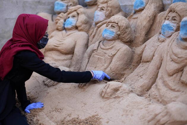 April 3, 2020, Gaza City, Gaza Strip, Palestinian Territory: A Palestinian artist Rana el-Ramlawi, 23, creates a sand sculpture stay home during awareness campaign about the spread of coronavirus disease (COVID-19), at her house Gaza city, on April 3, 2020. The United Nations has warned that a COVID-19 outbreak in Gaza could be disastrous, given the high poverty rates and weak health system in the coastal strip under Israeli blockade since 2007. Authorities in Gaza have said that more than 2,700 Palestinians are in home-isolation, mostly people who had returned from Egypt Gaza City Palestinian Territory - ZUMAap3_ 20200403_zaf_ap3_052 Copyright: xMahmoudxAjjourx