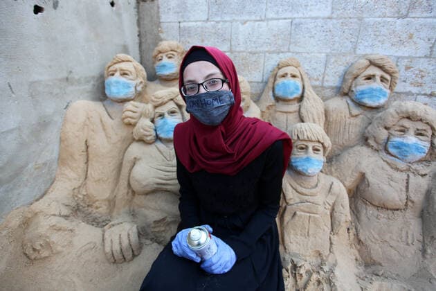 April 3, 2020, Gaza City, Gaza Strip, Palestinian Territory: A Palestinian artist Rana el-Ramlawi, 23, creates a sand sculpture stay home during awareness campaign about the spread of coronavirus disease (COVID-19), at her house Gaza city, on April 3, 2020. The United Nations has warned that a COVID-19 outbreak in Gaza could be disastrous, given the high poverty rates and weak health system in the coastal strip under Israeli blockade since 2007. Authorities in Gaza have said that more than 2,700 Palestinians are in home-isolation, mostly people who had returned from Egypt Gaza City Palestinian Territory - ZUMAap3_ 20200403_zaf_ap3_057 Copyright: xMahmoudxAjjourx