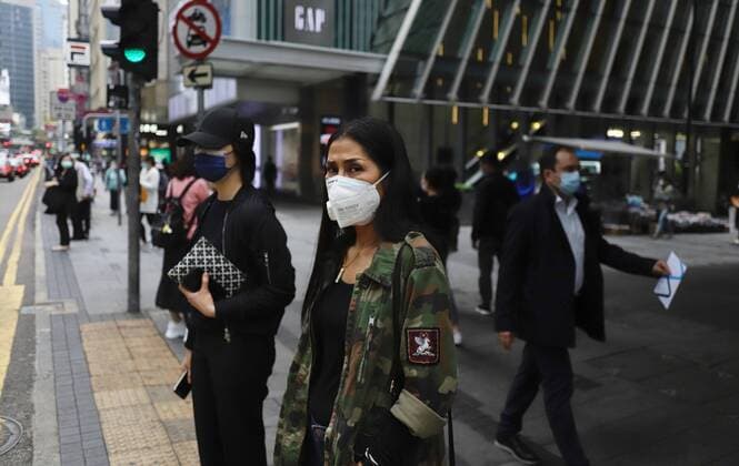 April 3, 2020, Hong Kong, CHINA: Masked citizens stand before zebra crossing in the financial hub in Central. According to WHO, coronavirus infections introduced by China Pneumonia is almost reaching 1 million mark worldwide continue to spread with alarming speed, showing no sign of dissipation.April-3,2020 Hong Kong.ZUMA Hong Kong CHINA - ZUMAl137 20200403_zap_l137_004 Copyright: xLiauxChung-renx