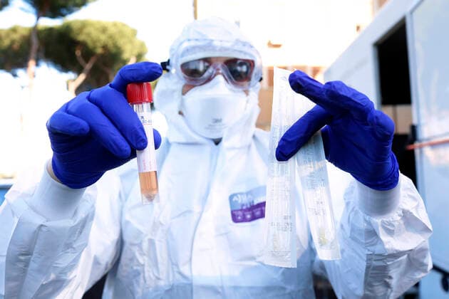 Rome April 4th 2020. Santa Maria della Pieta . Coronavirus emergency. Due to the spread of Covid-19 virus, Italy started a new procedure, a drive-through COVID-19 pharyngeal and nasal swab to test possible positivity to the infection . In the pictures, medical workers testing doctors and nurses of San Filippo Neri hospital. Photo Samantha Zucchi Insidefoto SamanthaxZucchi