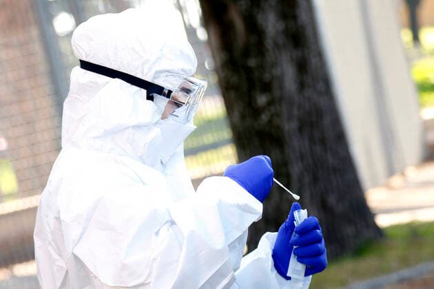 Rome April 4th 2020. Santa Maria della Pieta . Coronavirus emergency. Due to the spread of Covid-19 virus, Italy started a new procedure, a drive-through COVID-19 pharyngeal and nasal swab to test possible positivity to the infection . In the pictures, medical workers testing doctors and nurses of San Filippo Neri hospital. Photo Samantha Zucchi Insidefoto SamanthaxZucchi