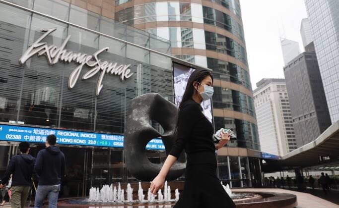 April 3, 2020, Hong Kong, CHINA: Young woman protected by facemask walk outside Hong Kong s financial core, EXCHANGE SQUARE in Central. Global coronavirus infections have just reached 1 million. Virus originated in Wuhan City China continue to spread on the Planetary scale creating huge negative impact on World Economy.April-3,2020 Hong Kong.ZUMA Hong Kong CHINA - ZUMAl137 20200403_zap_l137_009 Copyright: xLiauxChung-renx
